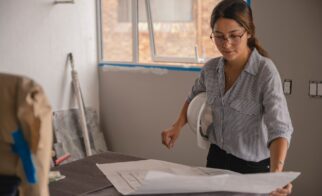 woman working on construction plan